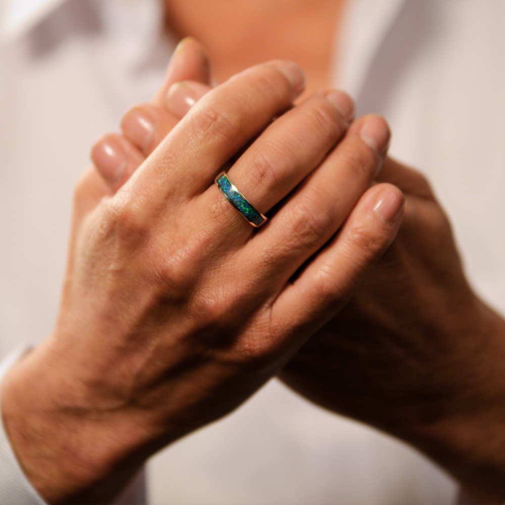 Opals & Ashes Half Circle Unisex Memorial Ring Silver. Modelled on male hand. Ashes blended with Pacific Blue Opals.