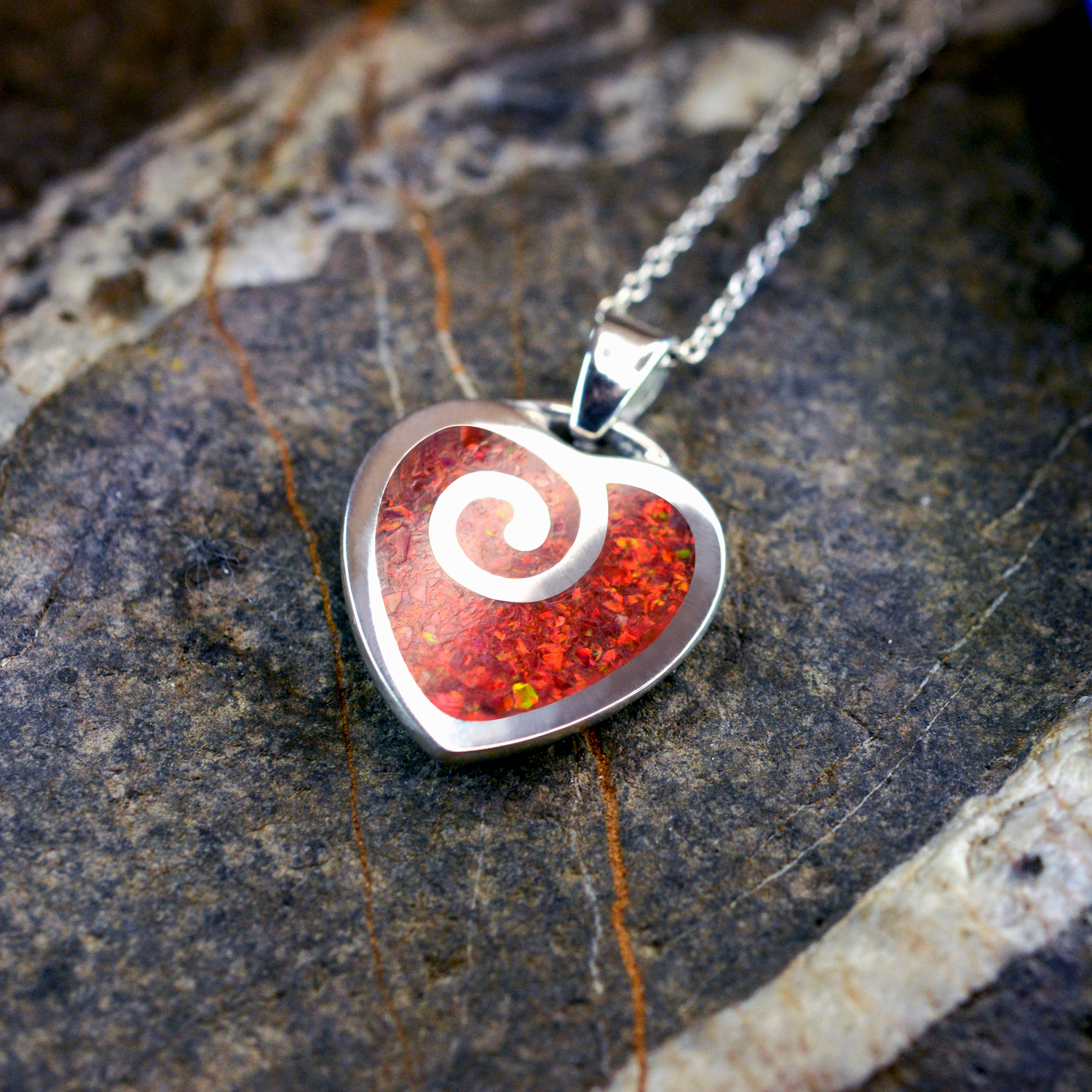 Opals & Ashes Spiral Heart Memorial Pendant Silver. Ashes blended with Ruby Red Opals.