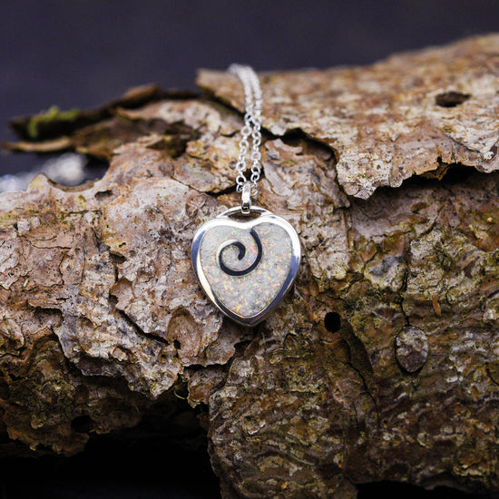 Opals & Ashes Spiral Heart memorial Pendant. Sterling Silver & Pearl White opals blended with our customers loved one’s ashes