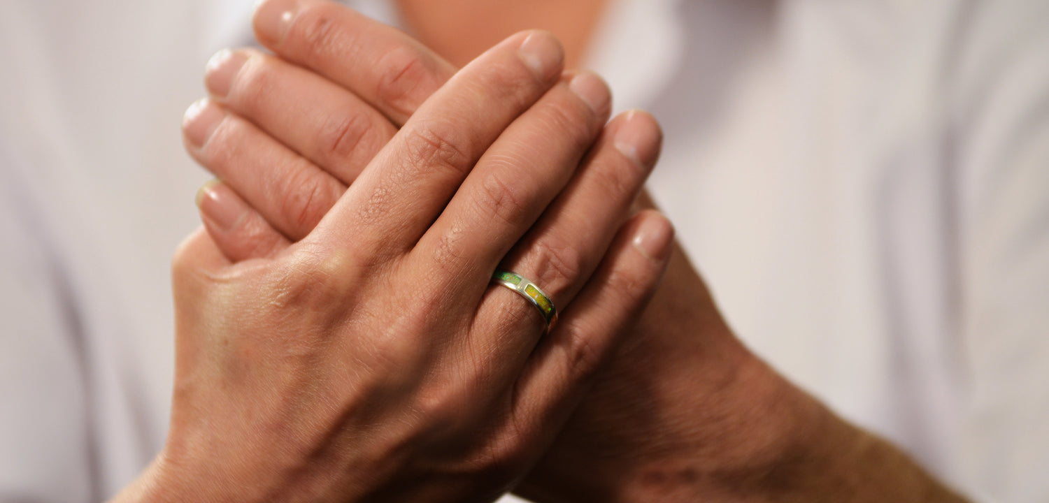 Opals & Ashes Half Circle Unisex Memorial Ring Silver. Modelled on male hand. Ashes blended with Pacific Blue Opals.