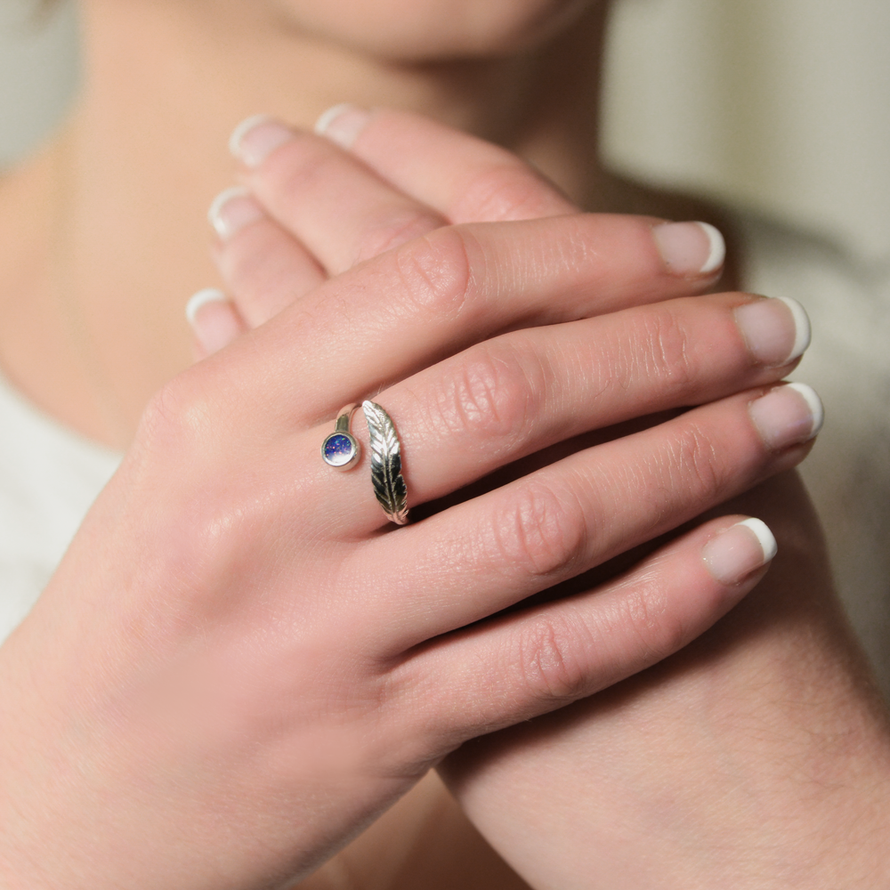 Opals & Ashes Angel Feather Memorial Ring Silver. Modelled on female hand. Ashes blended with Royal Blue Opals.